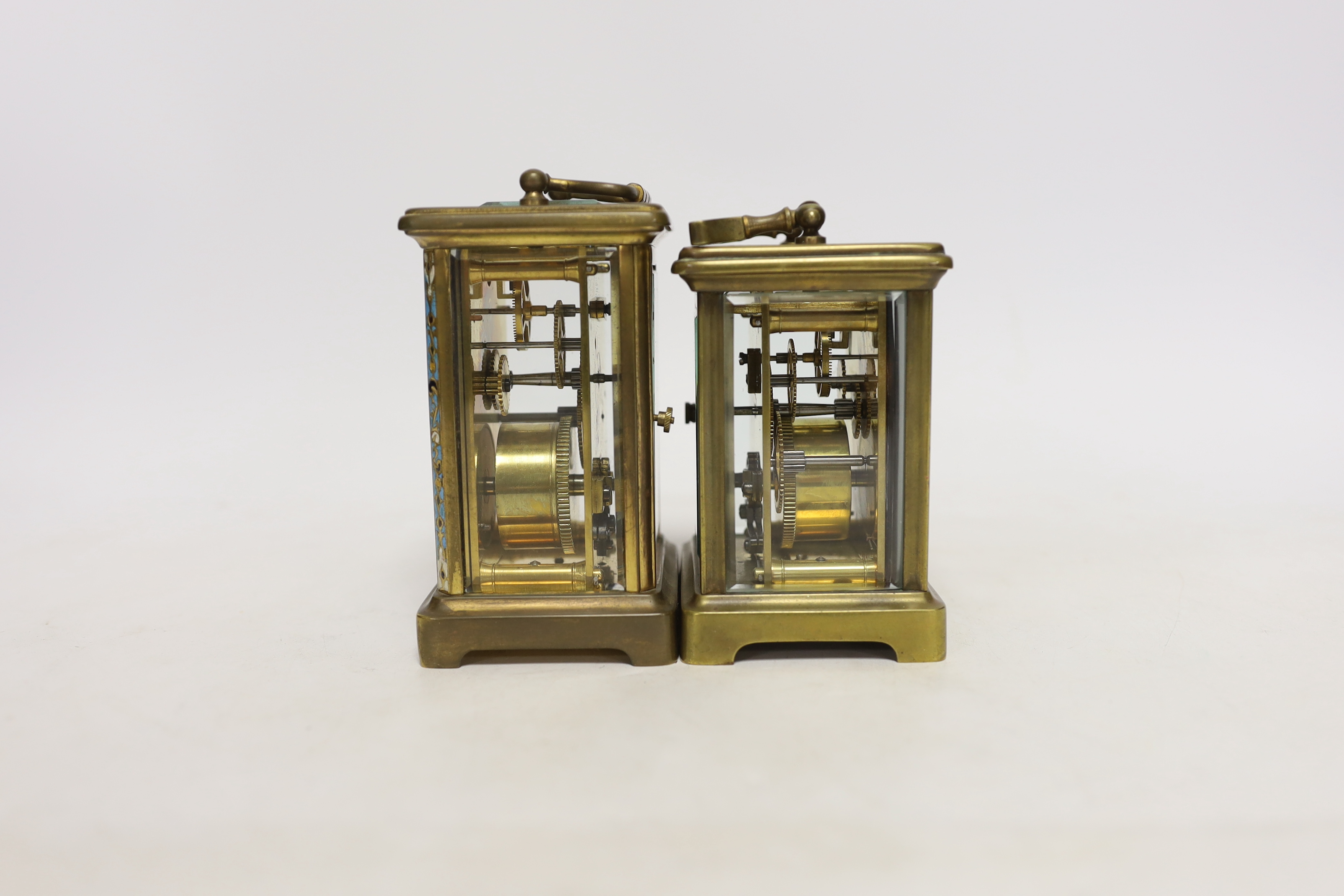 Two brass cased carriage timepieces including a French champleve enamel example with enamel dial, largest 15cm high
